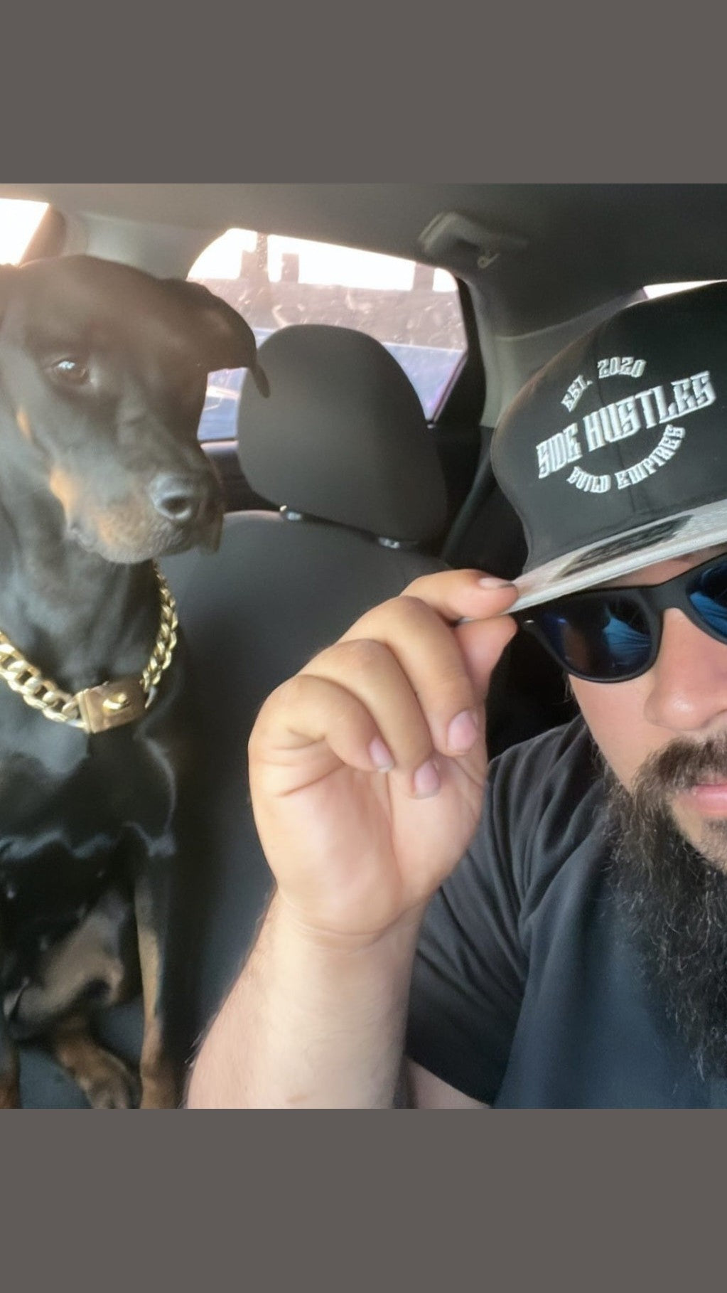 Man with side hustle wearing a side hustle snapback hat