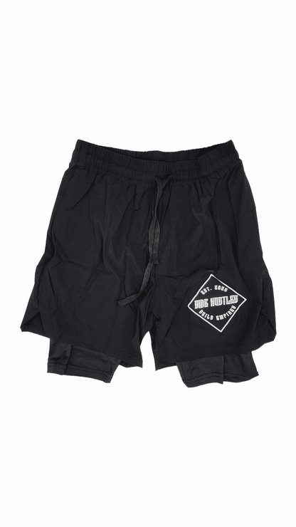 2 in 1 Compression Shorts nylon and compression shorts with an embroidered logo. comfortable and sleek hustle clothing for individuals with active lifestyles.